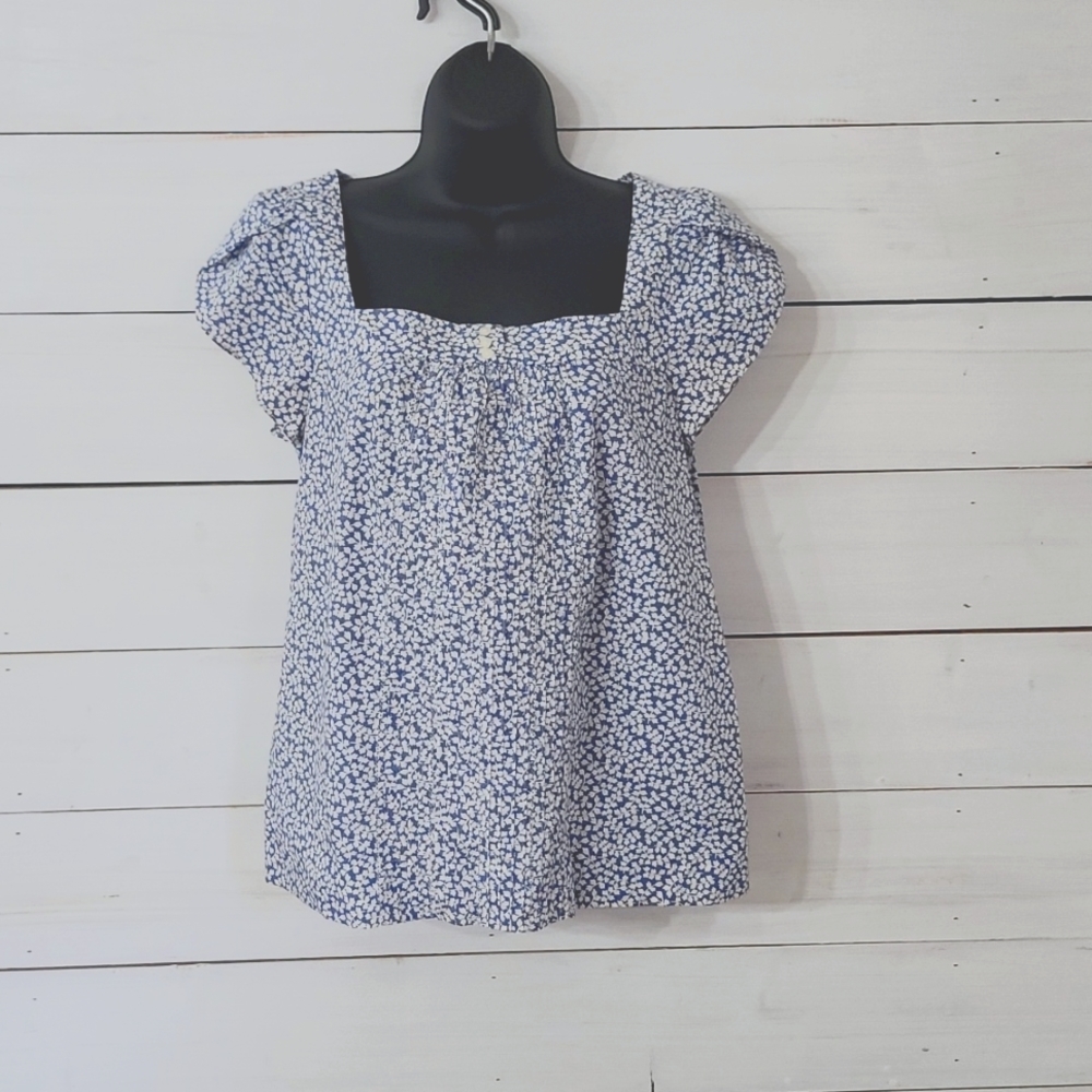 Size 4 American Eagle blue floral with smocking detail and flutter sleeves.
